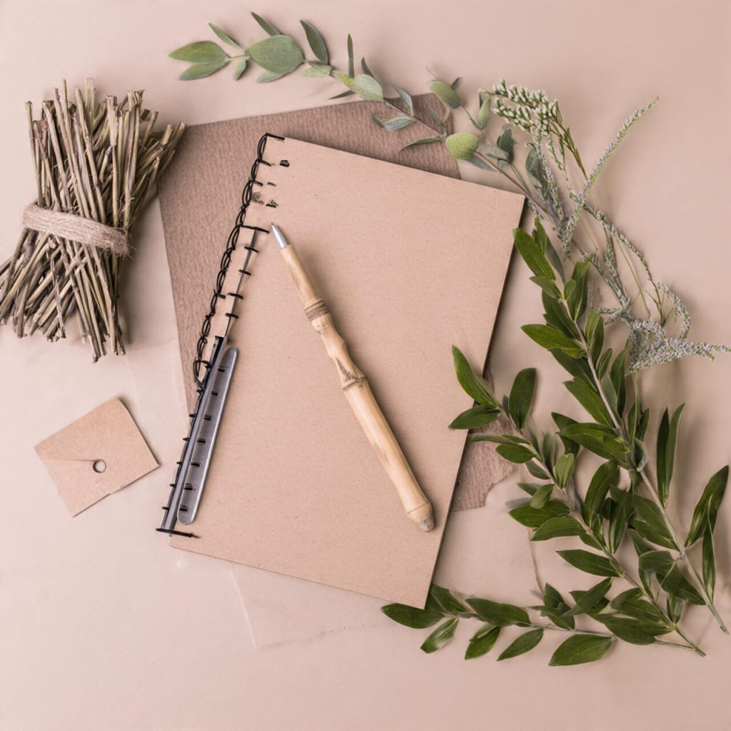 Eco-friendly flatlay with recycled stationery and natural materials representing sustainable local businesses