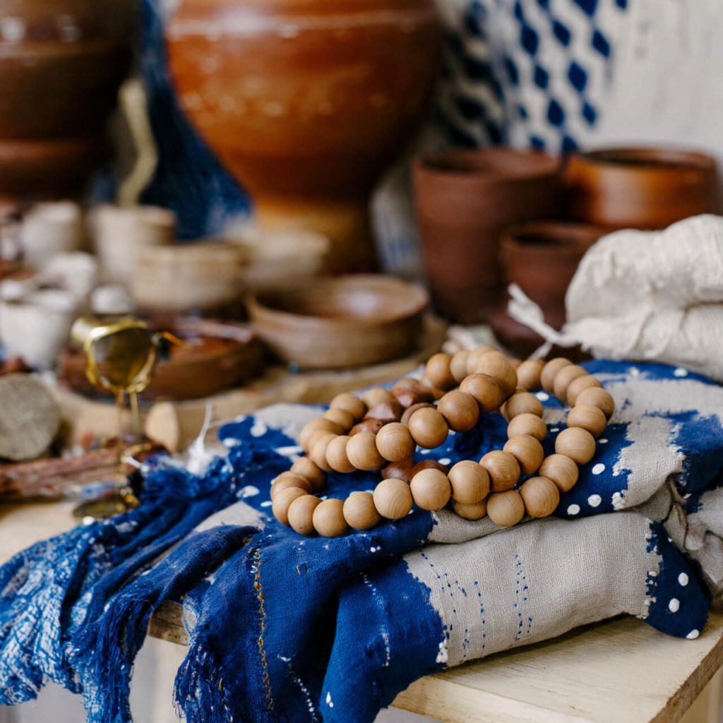 Flatlay of handmade crafts and upcycled materials in warm natural tones